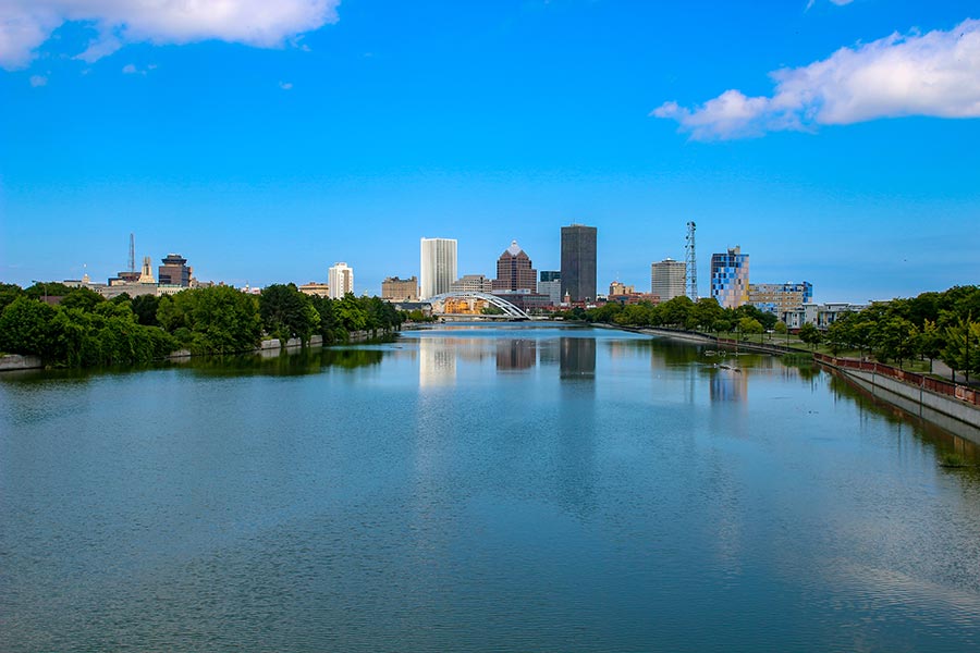 Rochester, NY Insurance - View of Rochester, New York Skyline on a Sunny Day, Seen From the Genesee River